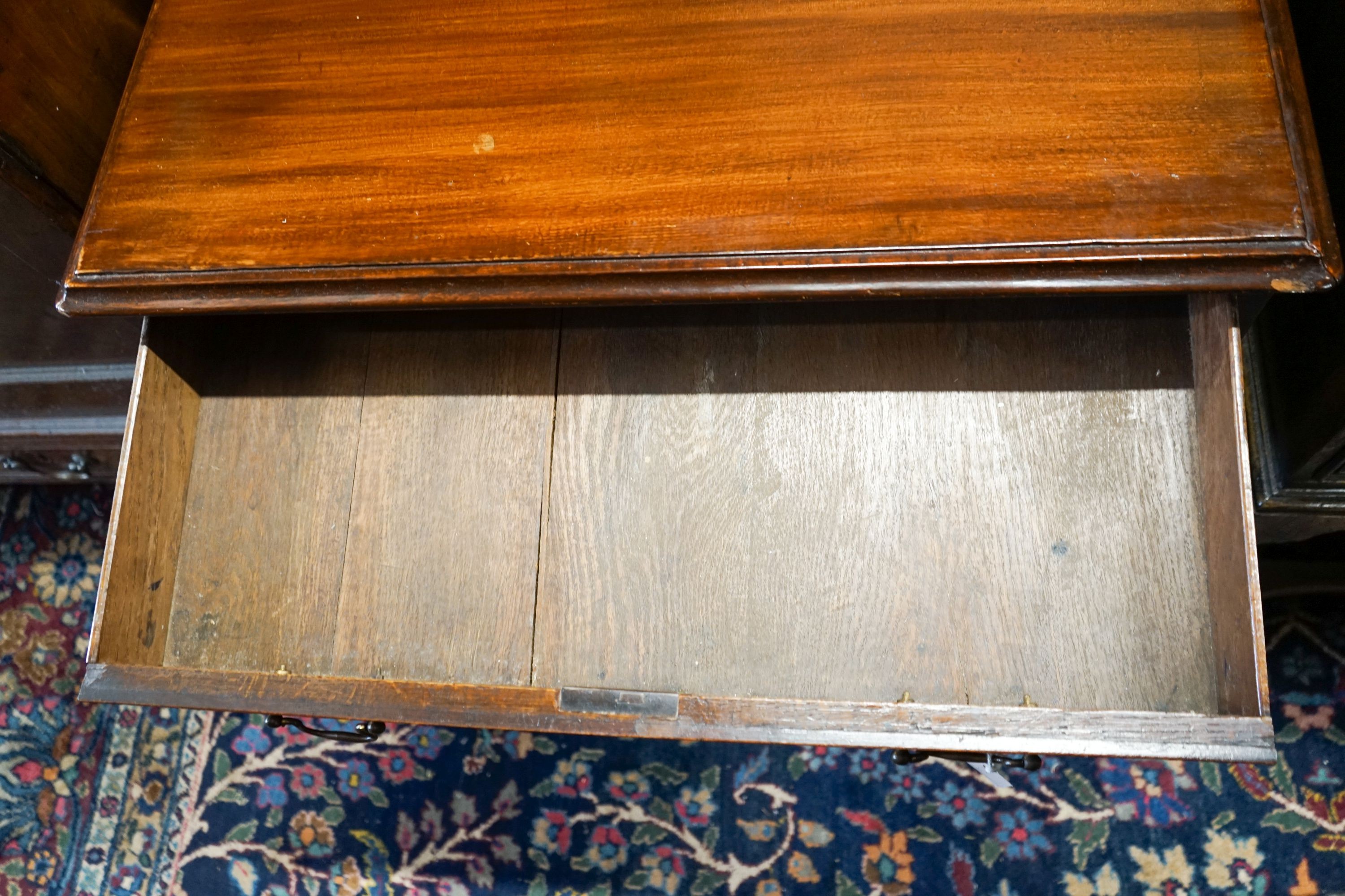 A George III and later mahogany kneehole desk, fitted seven drawers and recessed cupboard on ogee bracket feet, width 81cm, depth 47cm, height 71cm